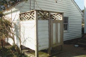 The master bath opens onto an outdoor shower planted with bamboo