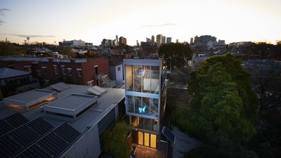 A unique design feature of the space is the water tanks that hug two sides  of the home