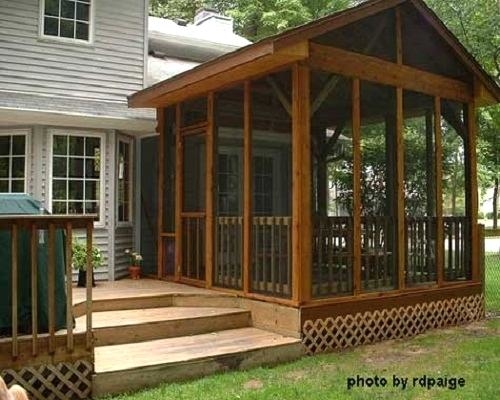 A small extension off this screened porch contains a captured doorway leading out onto the adjacent deck