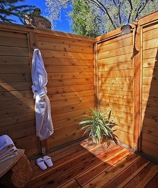 The Bali Cottage was built with old Bali teak panels and features not only  an outdoor shower but the much rarer outdoor kitchen