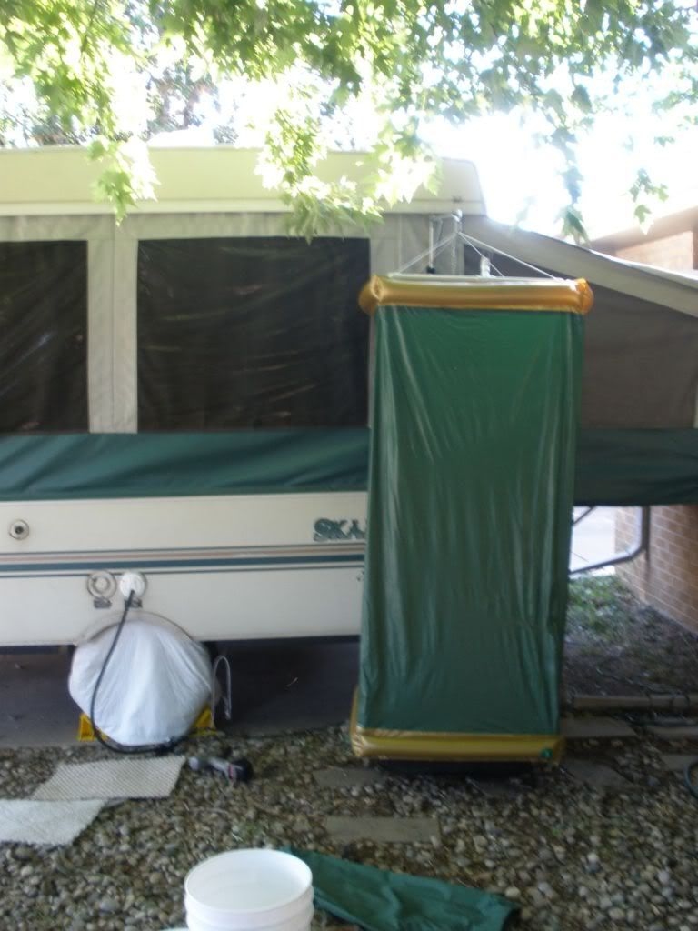 Who would have thought a  hula hoop, bungees, an oversized bucket, a shower curtain, and a water  container