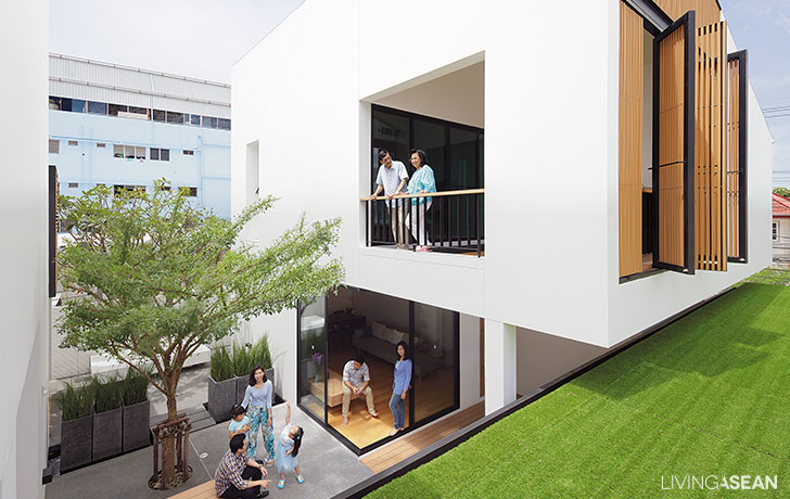 Both houses sit on the solid base of the heritage stone street wall,  relieved by the landscaped entry court