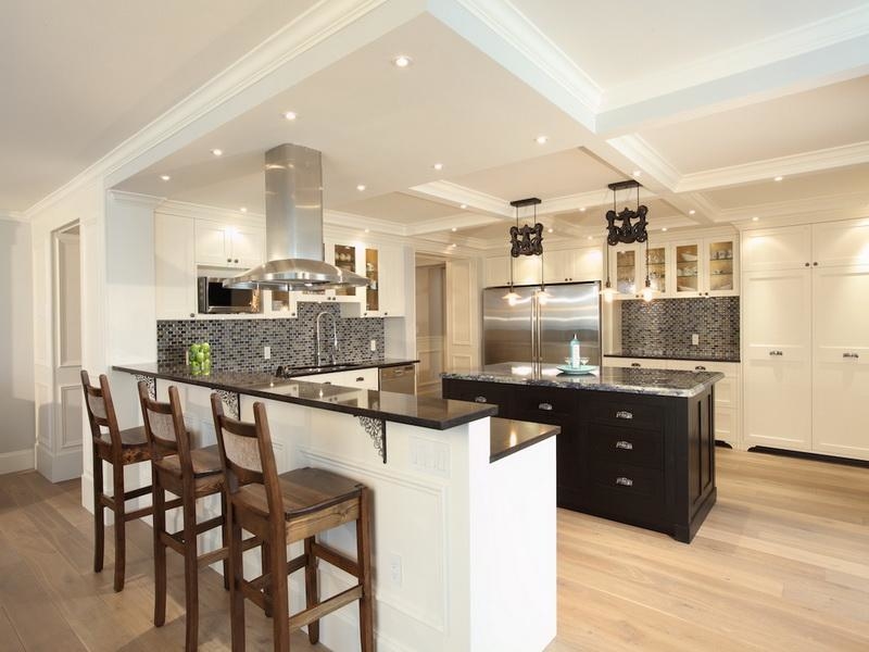 Narrow kitchen in white with a gorgeous island at its heart [Design:  Tran +