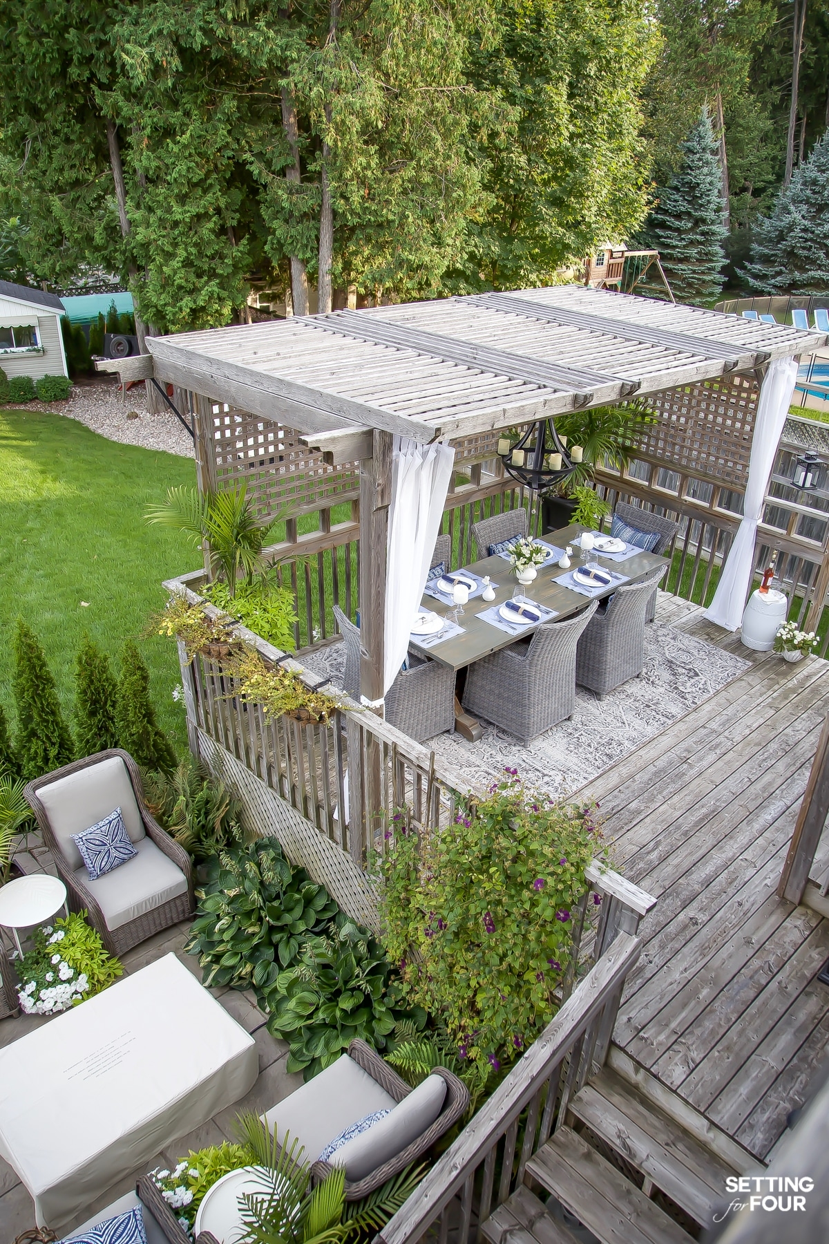 This 300 square foot covered backyard patio in New Orleans, Louisiana  features a sofa from West Elm and the Justina Blakeney Cohanga Hanging  Chair