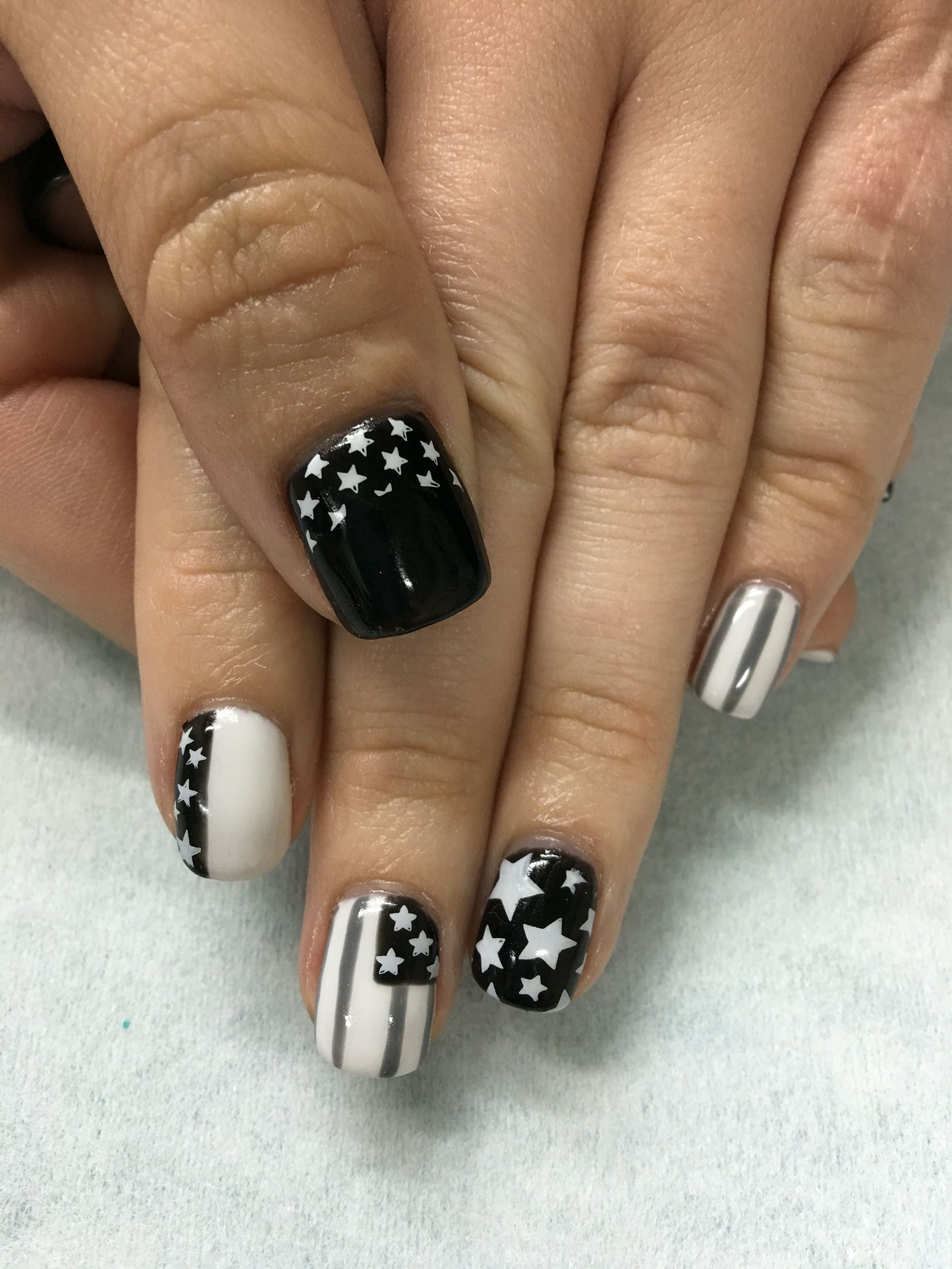 Super short nail design with black and gray gel colors with Swarovski black diamonds