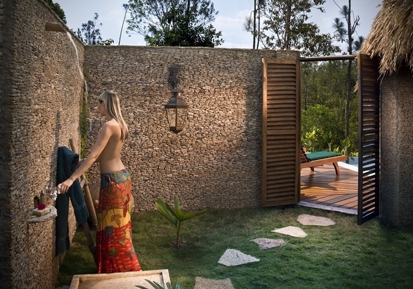 Tropical indoor and outdoor bathroom combo with outdoor shower area in private courtyard