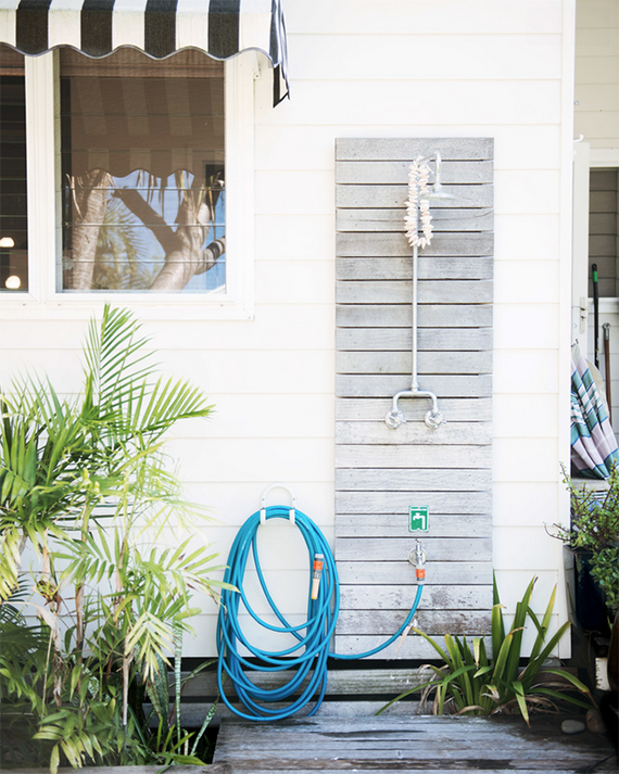 Part of the house, including a corner with an outdoor rinsing shower, is  made of brick reclaimed from building demolitions throughout Australia