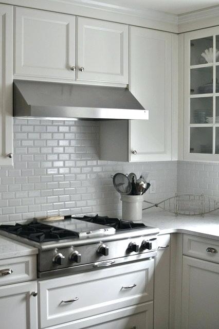 Herringbone marble backsplash in kitchen