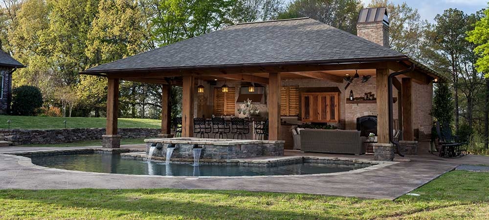 Pool, spa and outdoor kitchen  nestled up against the spa so drinks and snacks can be readily available